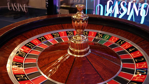 Live dealer studio with multiple camera angles showing baccarat table and card shoe